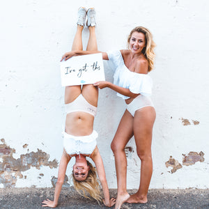 Women wearing organic underwear hold "I've got this" sign in support of Australian eco brand Powerpants